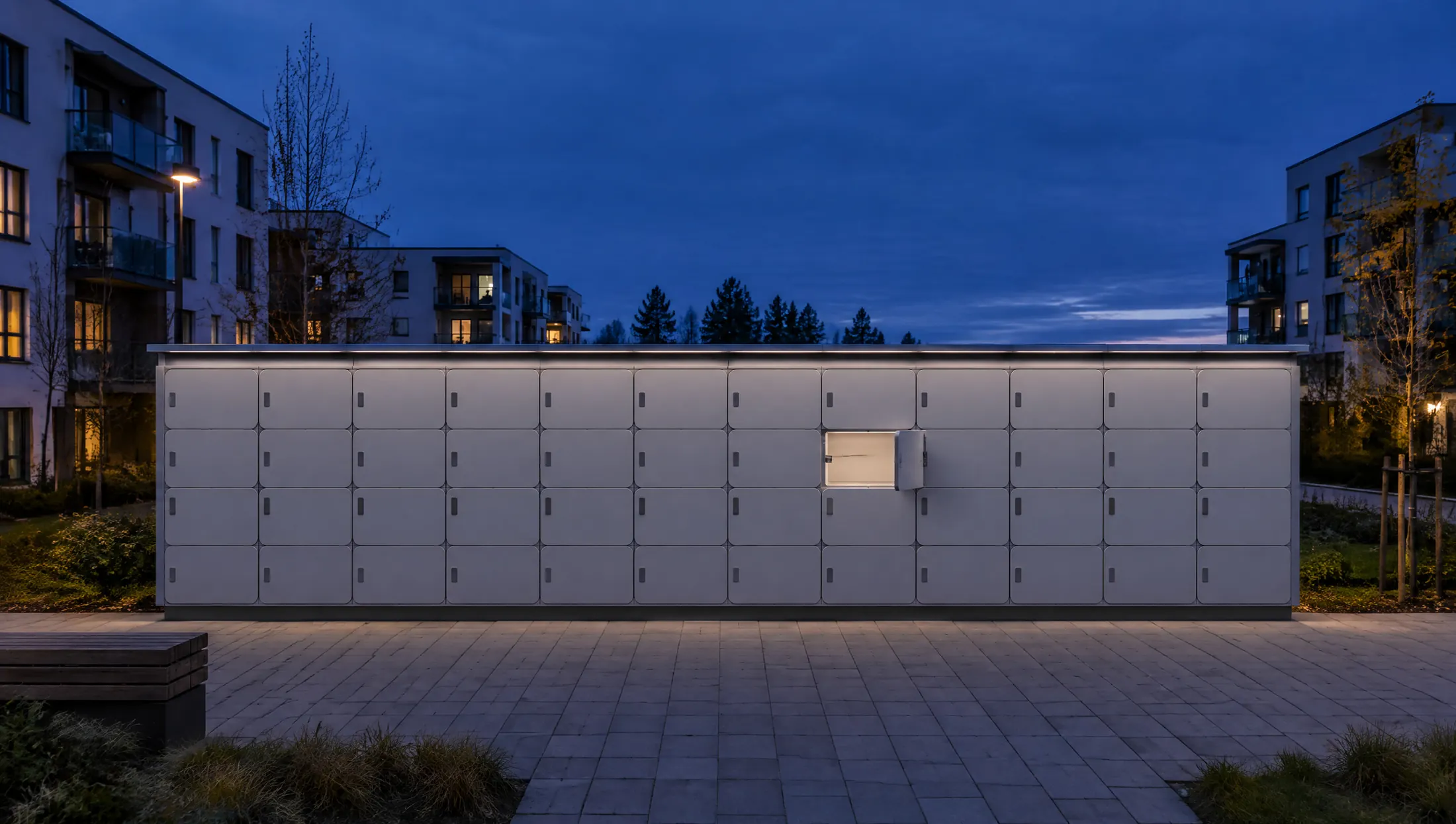 A long wall of parcel lockers at dusk with one door open